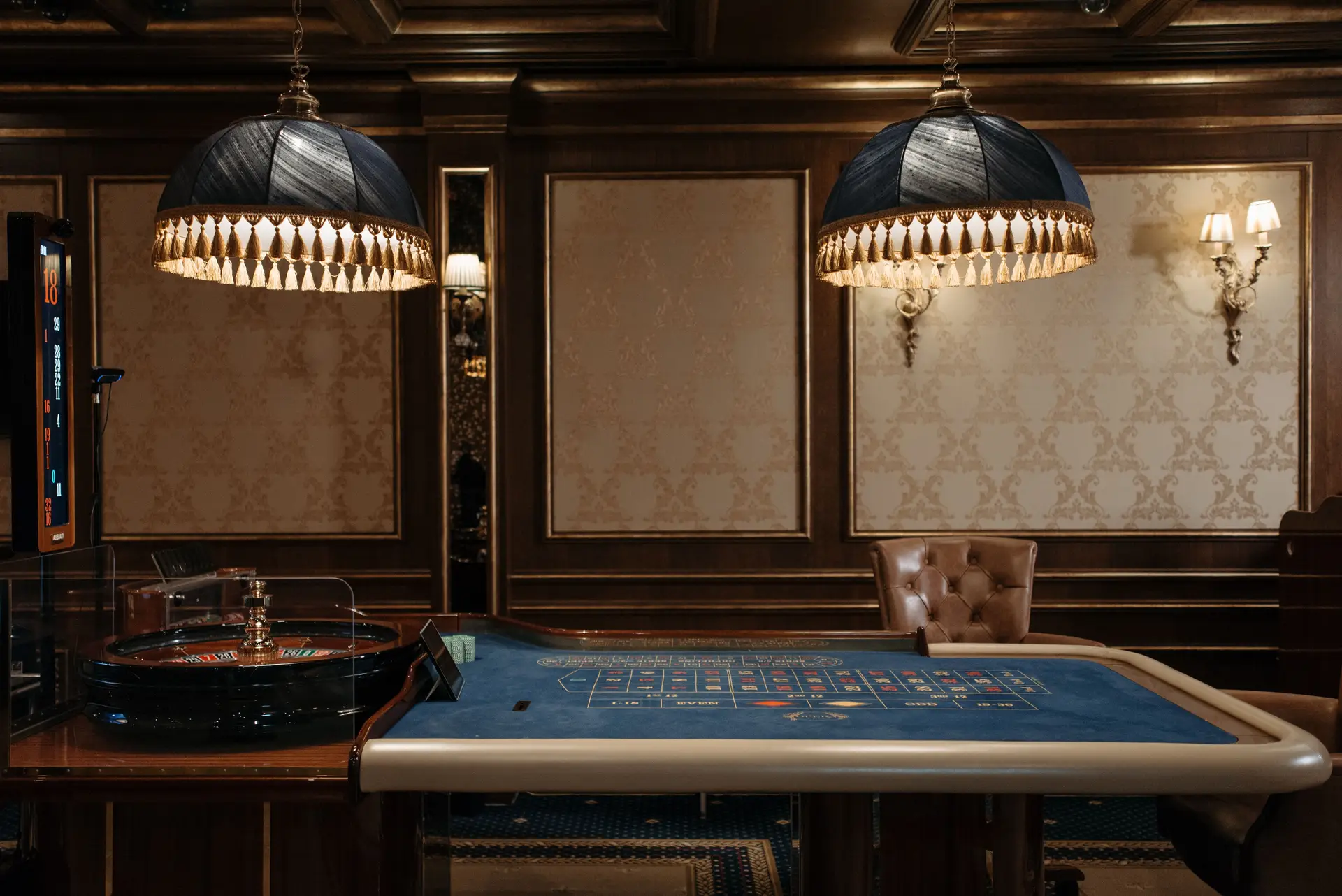 Luxurious casino interior with roulette tables and elegant lighting