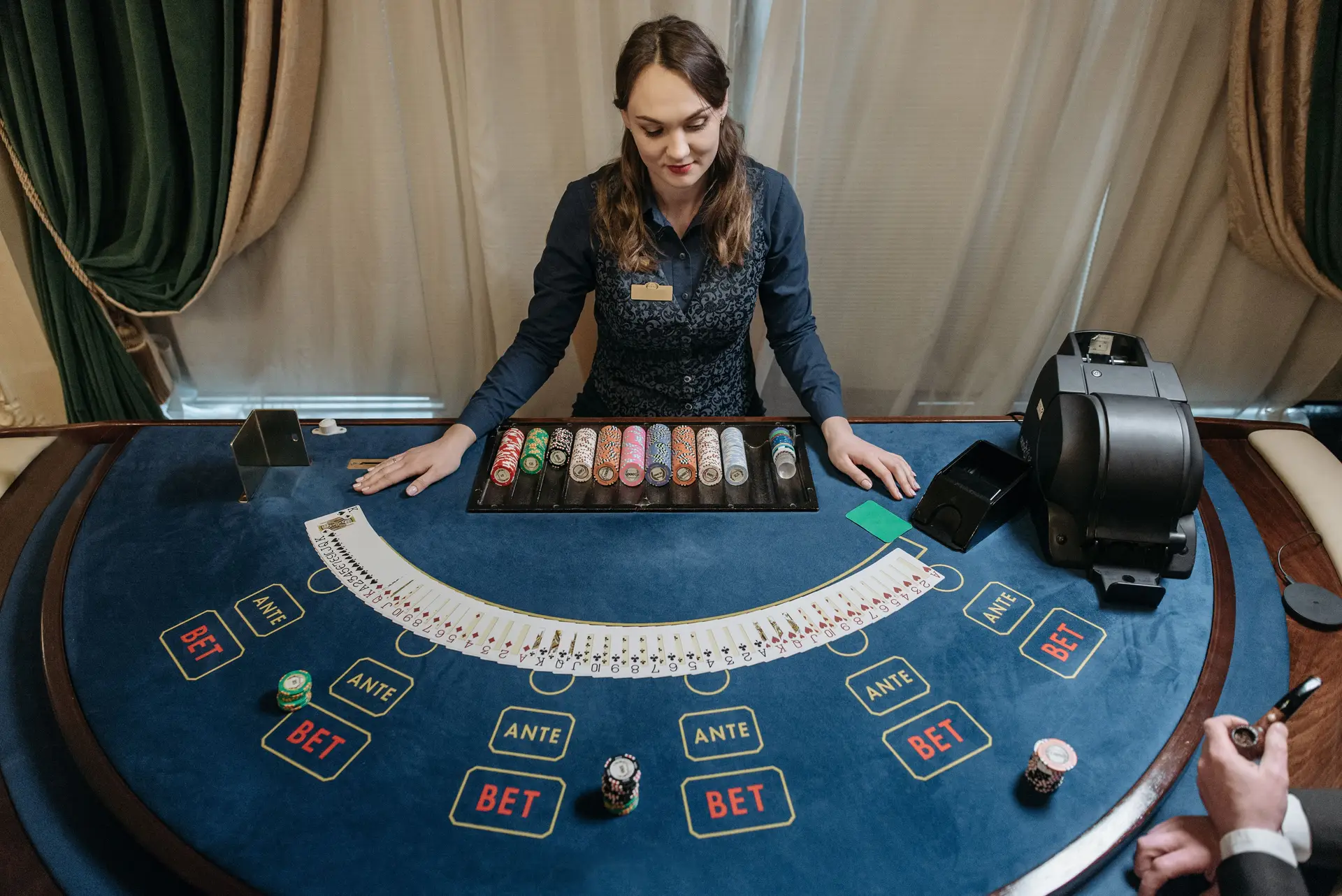 Professional casino dealer at table